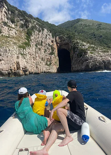 A family during a boat trip to Haxhi Ali Cave, in Vlore Albania