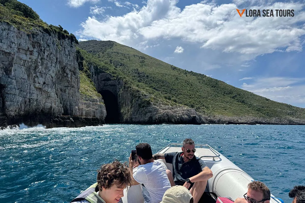A group of people, during a boat trip to the Haxhi Ali Cave, In Vlore Albania